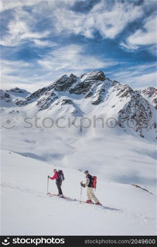 Retired sporty friends during a ski touring trip in the Swiss Alps
