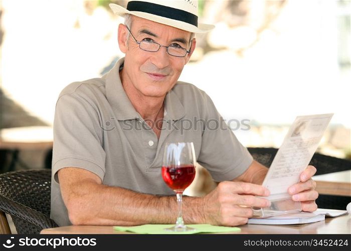 Retiree enjoying a glass of wine