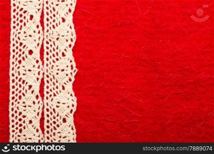 Retro border for invitations celebration. Vintage white lace over red textile background.