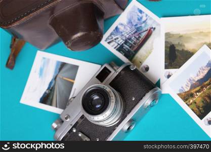 retro camera and photos on a blue background