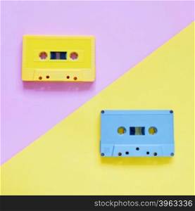 Retro cassette tapes on pastel color background, minimal style
