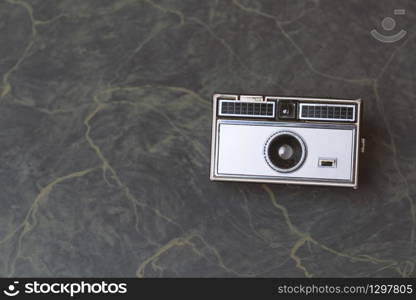 Retro classic 35mm photo camera on Background