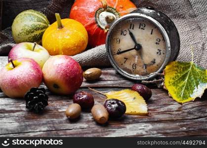 retro clock,pumpkin and chestnuts
