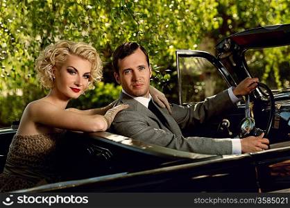 Retro couple in convertible