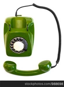 Retro green rotary telephone on a white background. Old green rotary telephone on a white background