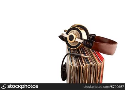 Retro headphones for professional audio with vintage vinyl records.