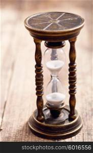 retro hourglass on wooden table