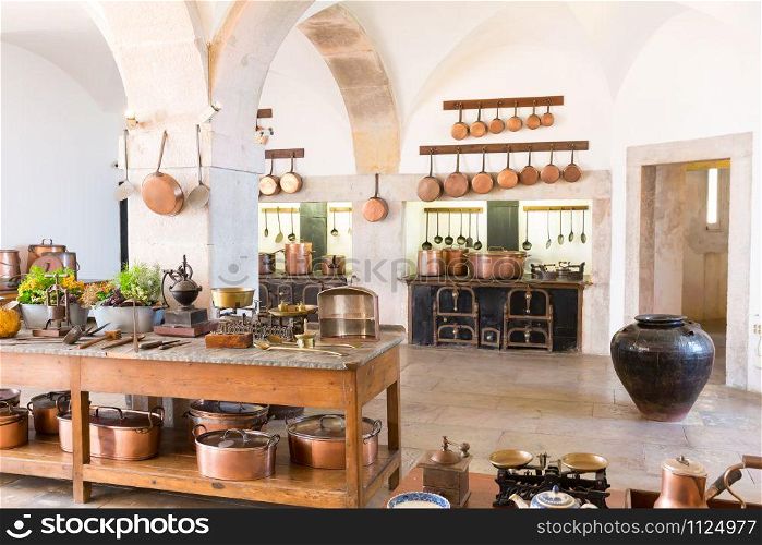 Retro kitchen interior with old brass kitchenware. Retro kitchen