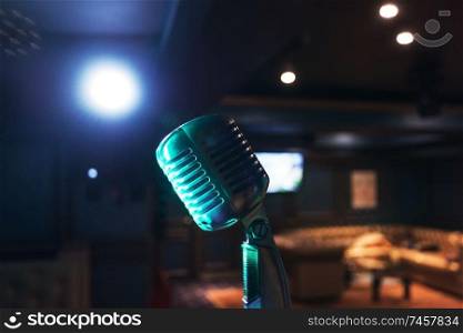 Retro music microphone on stage in a night club. Show or performance concept. Retro music microphone