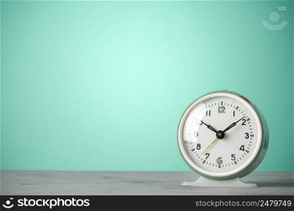 Retro old classic round alarm clock vintage color background with copy space