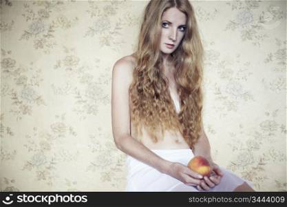 Retro photo of a beautiful young woman with peach