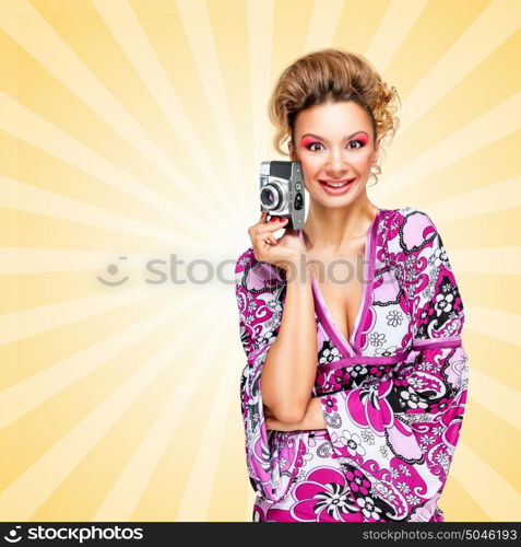 Retro photo of a happy fashionable hippie homemaker with an old vintage photo camera smiling on colorful abstract cartoon style background.