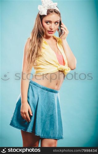 Retro pin up girl talking.. Retro pin up girl talking. Woman with cell using technology.