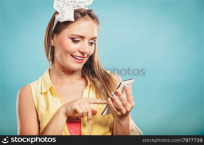 Retro pin up girl texting.. Retro pin up girl texting. Woman with cell using technology.