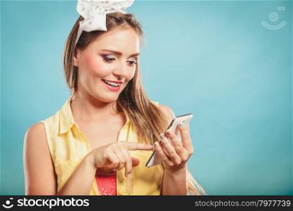Retro pin up girl texting.. Retro pin up girl texting. Woman with cell using technology.