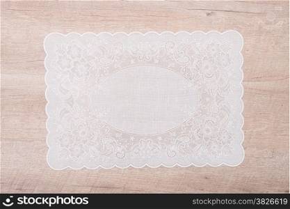 Retro place mat on wooden deck table.