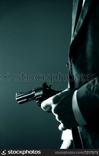 Retro secret agent with pistol revolver gun in hand in vintage crime thriller mockup cover photo.