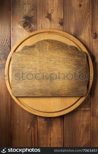 retro signboard at wooden cutting board background texture