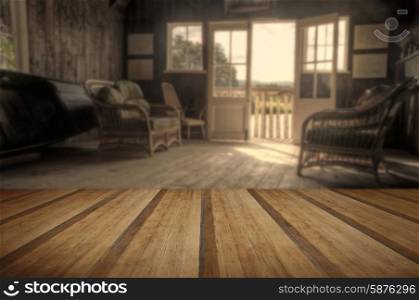 Retro style image of old boat house in bright Summer sun giving nostalgic feelings with wooden planks floor