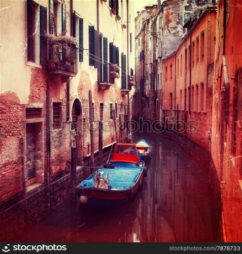 Retro style image of small canal in Venice, Italy