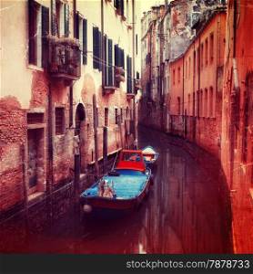 Retro style image of small canal in Venice, Italy