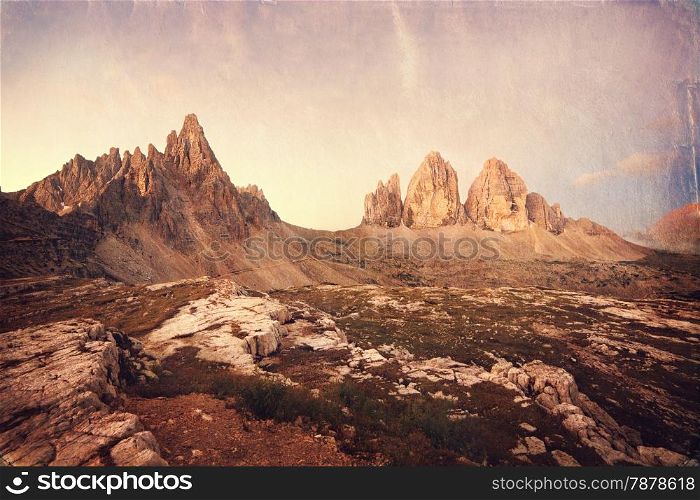 Retro style image of Tre Cime at sunrise, Italian Dolomites