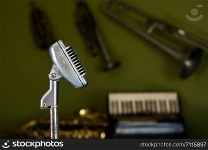 Retro style microphone on table front music instrument
