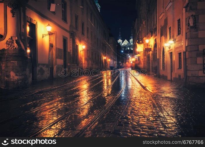 Retro style photo of old European city at night