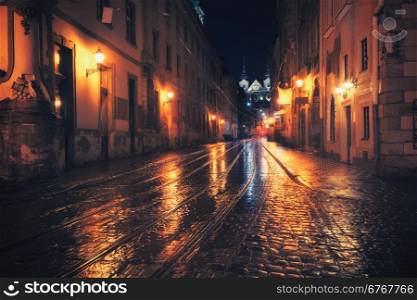 Retro style photo of old European city at night