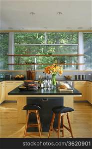 Retro styled kitchen with black worktop and kitchen island