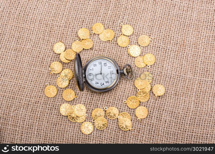 Retro styled pocket watch with fake gold coins around