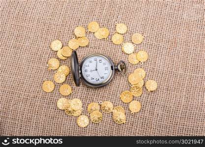 Retro styled pocket watch with fake gold coins around