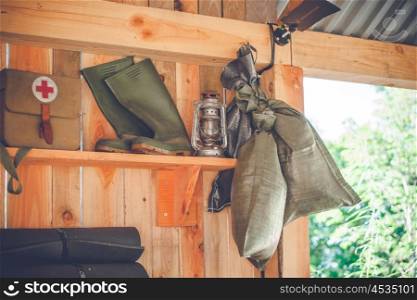 Retro survival kit in a wooden cabin in the nature