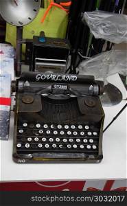 Retro syled tiny typewriter model on white background. Retro syled tiny typewriter model on a white background