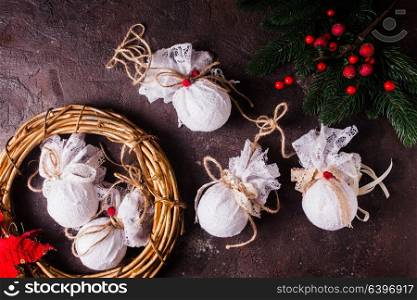 Retro textile Christmas baubles with white lace and rope. Retro textile Christmas baubles