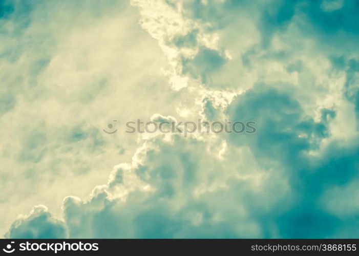 retro toned cloudscape background with blue and yellow tint