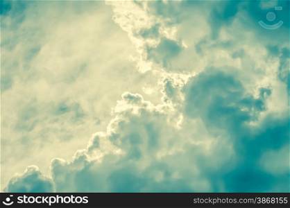 retro toned cloudscape background with blue and yellow tint