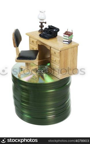 Retro typewriter on wooden desk on a stack of computer disks - path included
