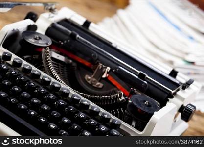 Retro typewriter with white paper