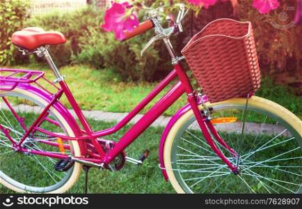 Retro Vintage city bike parked in summer garden
