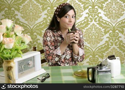 Retro woman drinking coffee on kitchen vintage wallpaper