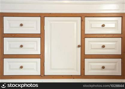 retro wooden closet with drawers closeup, modern interior minimalist style wardrobe clean. retro wooden closet with drawers closeup, modern interior minimalist style wardrobe