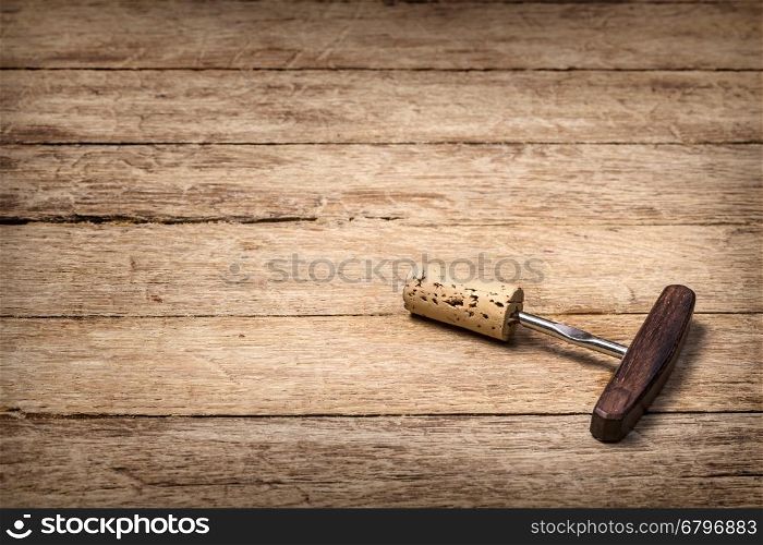 retro wooden corkscrew on the brown table