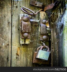 Retro wooden door with old rusty lock