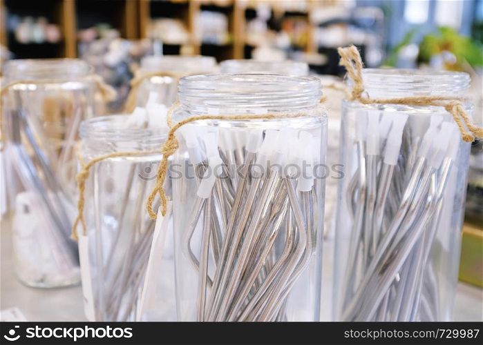 Reusable stainless straw for drink in glass of jar for selling, sustainable products, zero waste concept