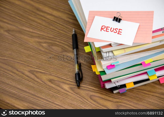 Reuse; The Pile of Business Documents on the Desk