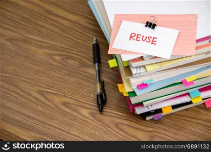 Reuse; The Pile of Business Documents on the Desk