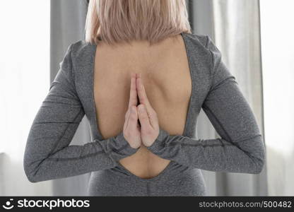 reverse namaste yoga position