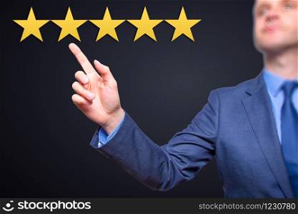Review, increase rating or ranking, evaluation and classification concept. Businessman pointing on five yellow stars to increase rating of his company.