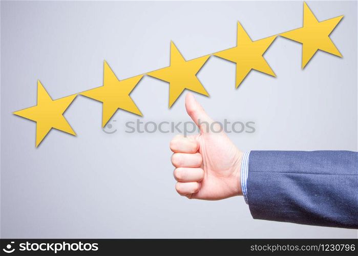 Review, rating, ranking, evaluation and classification concept. Businessman is satisfied with company 5 stars rating. Isolated on white